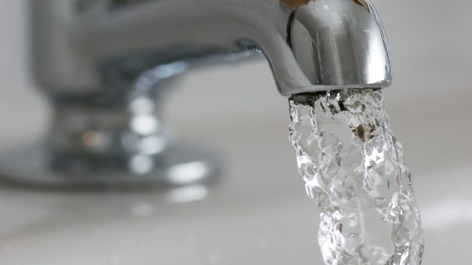 Water flows from a domestic tap, United Kingdom