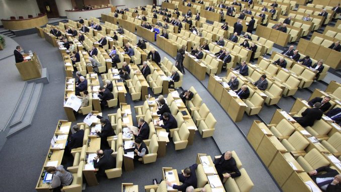 Russia's deputies discuss a nuclear arms reduction pact before the final vote during a session of the lower house of parliament, the State Duma, in Moscow